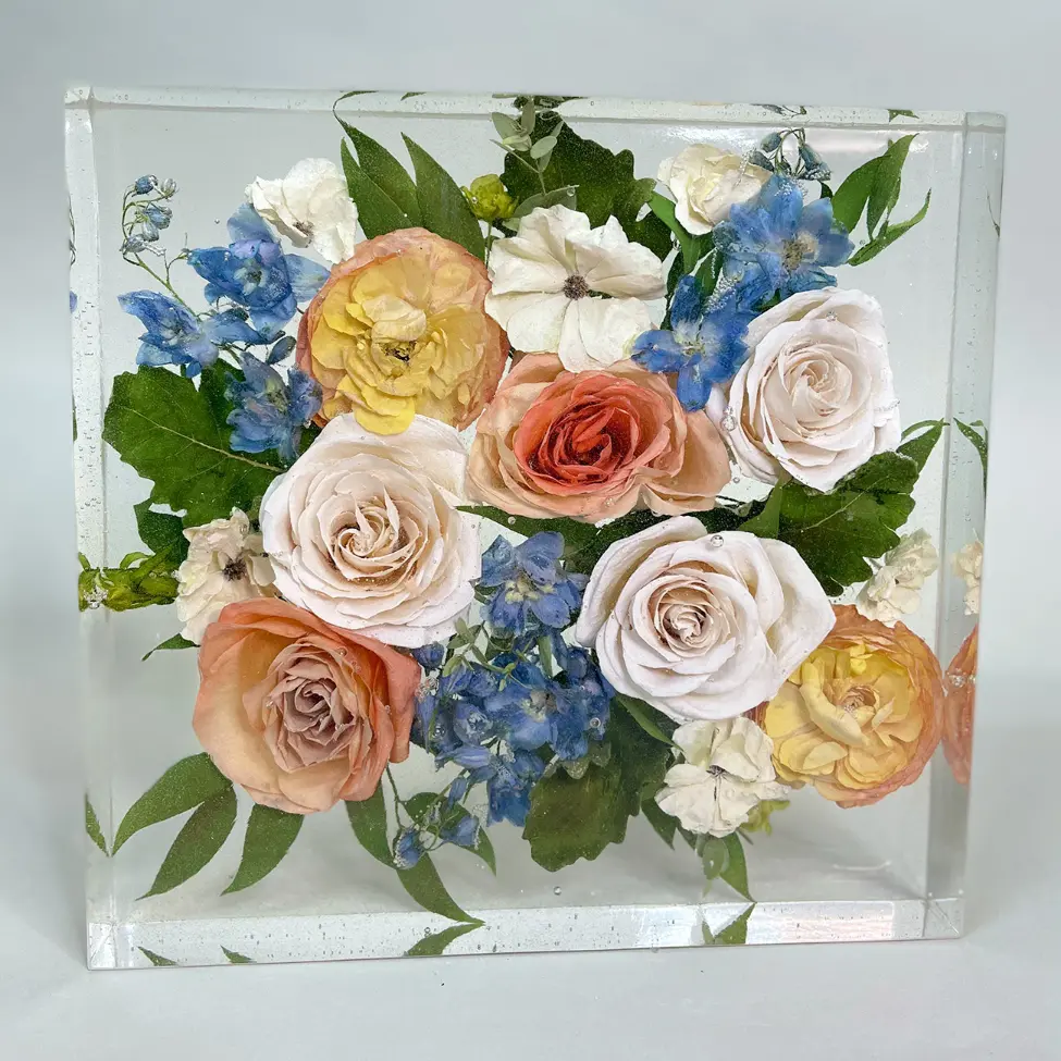 Resin tablet with peach, blush, and blue wedding flowers
