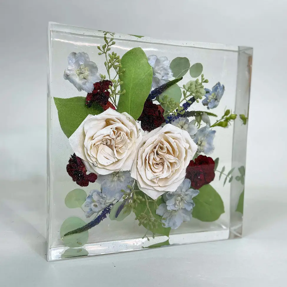 Resin floral tablet with white roses, berries, and blue blooms